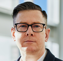 Photo du PDG Alexander Hughes, dirigeant de la plateforme de trading de crypto-monnaies
